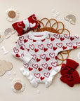 Snuggle Hearts Knit Ruffle Romper